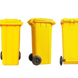 Isolated big yellow garbage bin or trash can and black wheels in three dimension with clipping path